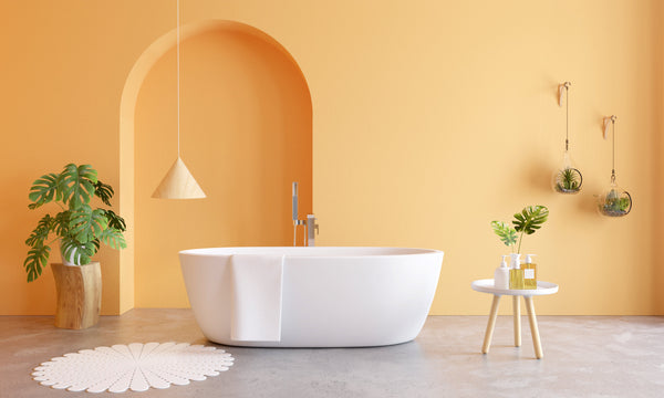 Modern freestanding bathtub in minimalist spa bathroom with warm neutral tones
