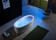 A freestanding bath tub with a glossy white finish and modern aesthetics, perfect for elegant bathroom space in best price