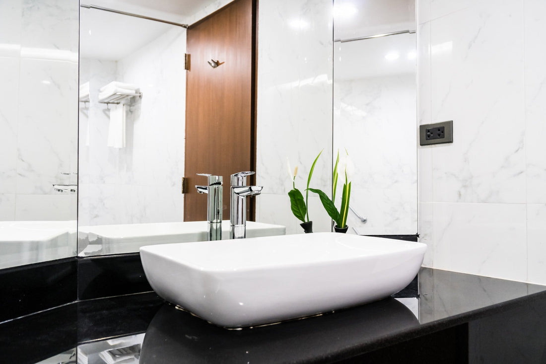 Contemporary countertop bathroom sink with a square basin design and modern vanity installation.