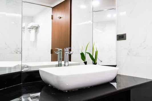 Contemporary countertop bathroom sink with a square basin design and modern vanity installation.