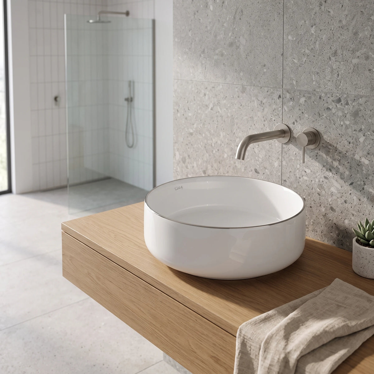 Round Above Counter Wash Basin with Gold Rim Edge - White in a room setting