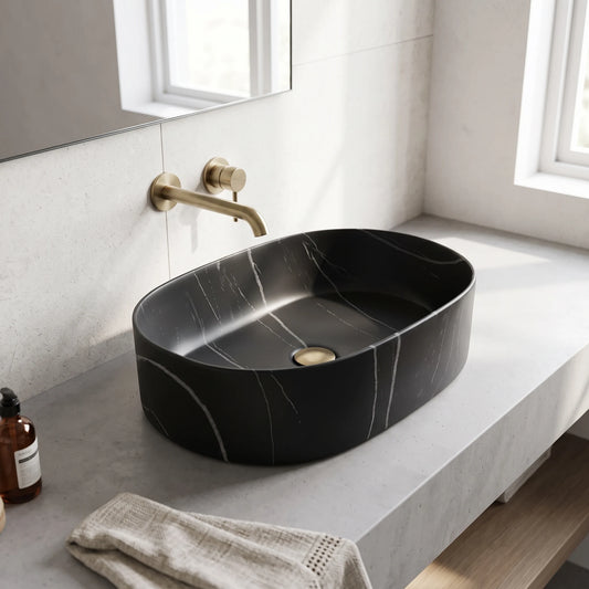 Oval Above Counter Wash Basin - Matt Black Marble in a room setting