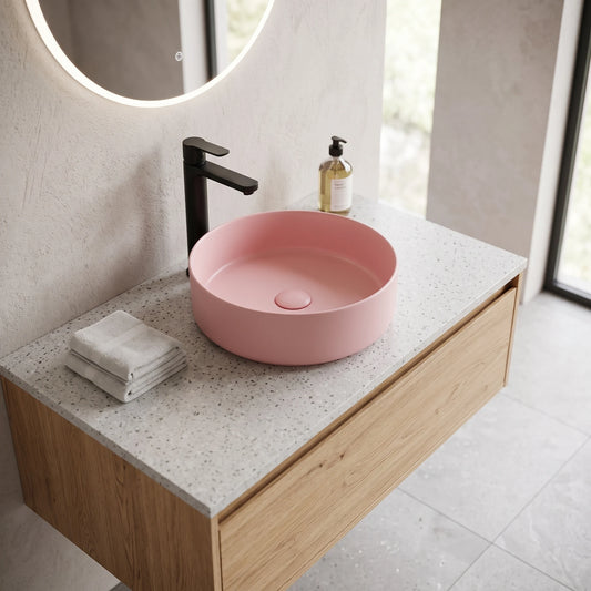 Round Above Counter Wash Basin c/w Waste - Pink in a room setting