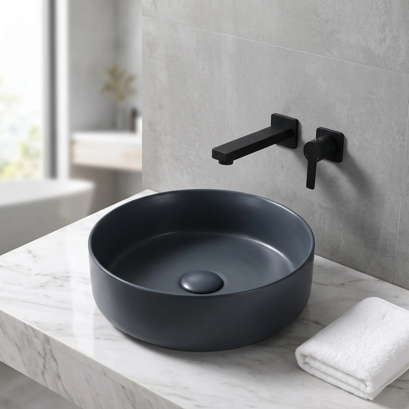 Round Above Counter Wash Basin with Waste - Matt Black in a room setting